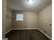 Laundry room with window and overhead shelving at 2929 Stratford Mill Rd, Lithonia, GA 30038