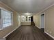 Open living room with view of kitchen and hardwood floors at 2929 Stratford Mill Rd, Lithonia, GA 30038