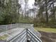 Wooden deck with steps leading down to the backyard at 2929 Stratford Mill Rd, Lithonia, GA 30038