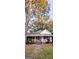 Charming white house with a wraparound porch, and mature trees at 5002 Westbrook Rd, Union City, GA 30291