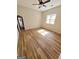 Bedroom with hardwood floors, ceiling fan and access to another room at 275 Allie Dr, Mcdonough, GA 30252