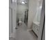 Updated bathroom with grey tile floors and a shower/tub combo at 275 Allie Dr, Mcdonough, GA 30252