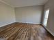 Spacious living room with hardwood floors and large window at 275 Allie Dr, Mcdonough, GA 30252