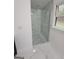 Large walk-in shower with glass enclosure and marble tile at 275 Allie Dr, Mcdonough, GA 30252
