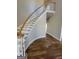 Grand curved staircase, hardwood floors, and white railings at 275 Allie Dr, Mcdonough, GA 30252