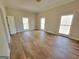 Bright bedroom with hardwood floors and multiple windows at 275 Allie Dr, Mcdonough, GA 30252