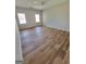 Spacious bedroom with hardwood floors and two windows at 275 Allie Dr, Mcdonough, GA 30252