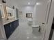 Luxurious bathroom with double vanity, soaking tub, and marble floors at 275 Allie Dr, Mcdonough, GA 30252