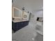Stunning bathroom with double vanity, a freestanding tub, and marble floors at 275 Allie Dr, Mcdonough, GA 30252