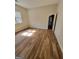 Bedroom with hardwood floors and access to another room at 275 Allie Dr, Mcdonough, GA 30252