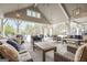 Inviting pool area with covered seating and lounge at 240 Grand Oak Way, Sharpsburg, GA 30277