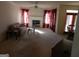 Living room features a fireplace and access to the dining area at 440 Falling Leaf Ct, Mcdonough, GA 30253
