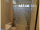 Bathroom with bathtub and floral-patterned wallpaper at 440 Falling Leaf Ct, Mcdonough, GA 30253