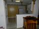Kitchen features white cabinets, appliances, and an eat-in area at 440 Falling Leaf Ct, Mcdonough, GA 30253