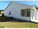 Side view of home with screened porch, AC unit, and yard at 440 Falling Leaf Ct, Mcdonough, GA 30253