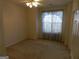 Bright bedroom with carpeted floor and window coverings at 440 Falling Leaf Ct, Mcdonough, GA 30253