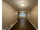 Spacious living room with dark wood floors and neutral walls at 4310 Bakers Ferry Sw Rd, Atlanta, GA 30331