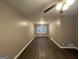 Spacious living room with dark wood floors and neutral walls at 4310 Bakers Ferry Sw Rd, Atlanta, GA 30331