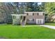 Newly renovated ranch home with gray exterior and attached garage at 4310 Bakers Ferry Sw Rd, Atlanta, GA 30331