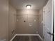 Laundry room with shelving and hookups for washer and dryer at 4310 Bakers Ferry Sw Rd, Atlanta, GA 30331