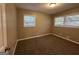 Well-lit bedroom with carpet flooring and large windows at 4310 Bakers Ferry Sw Rd, Atlanta, GA 30331