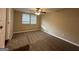 Simple bedroom with carpet, ceiling fan, and neutral decor at 3168 Mcafee Rd, Decatur, GA 30032
