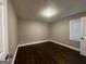 Spacious bedroom featuring dark hardwood floors and neutral walls at 3168 Mcafee Rd, Decatur, GA 30032