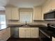 Modern kitchen featuring white cabinets, granite countertops, and stainless steel appliances at 3168 Mcafee Rd, Decatur, GA 30032