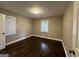 Spacious bedroom with hardwood floors and neutral walls at 3168 Mcafee Rd, Decatur, GA 30032
