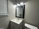 Clean bathroom with vanity, toilet, and mirror at 3168 Mcafee Rd, Decatur, GA 30032