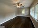 Living room with hardwood floors, neutral walls, and large windows at 3168 Mcafee Rd, Decatur, GA 30032