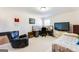 Bright bedroom with a bed, desk, and large TV at 4482 Hazeltine Dr, Atlanta, GA 30349