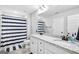 Bathroom with double vanity and black and white shower curtain at 92 Gordon Oaks Way, Moreland, GA 30259