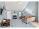 Living room with vaulted ceiling, fireplace and large sectional at 1067 Field View Dr, Mcdonough, GA 30253