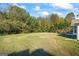 Large grassy backyard with mature trees at 1067 Field View Dr, Mcdonough, GA 30253
