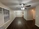 Open living and dining area with dark hardwood floors at 208 Rankin Cir, Mcdonough, GA 30253