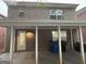 Brick house with covered patio, landscaping, and a large backyard at 208 Rankin Cir, Mcdonough, GA 30253