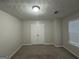 Spacious bedroom with double doors and window coverings at 208 Rankin Cir, Mcdonough, GA 30253