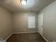 Well-lit bedroom with a window and single door at 208 Rankin Cir, Mcdonough, GA 30253