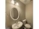 Small bathroom with white sink, toilet, and vanity at 208 Rankin Cir, Mcdonough, GA 30253