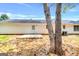 Rear view of a house showing a back door and a small patio at 138 Michelle Dr, Mcdonough, GA 30252