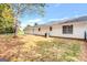 Side view of a house showing a back door and a small patio at 138 Michelle Dr, Mcdonough, GA 30252