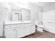 Clean bathroom with white vanity and bathtub at 138 Michelle Dr, Mcdonough, GA 30252
