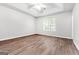 Large bedroom with wood-look flooring and ceiling fan at 138 Michelle Dr, Mcdonough, GA 30252