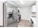 Modern kitchen featuring stainless steel appliances and light wood flooring at 138 Michelle Dr, Mcdonough, GA 30252