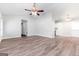 Open living room and dining area with hardwood floors and ceiling fan at 138 Michelle Dr, Mcdonough, GA 30252