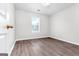 Spacious bedroom with wood-look flooring and ceiling fan at 138 Michelle Dr, Mcdonough, GA 30252