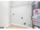 Laundry room with shelving and new water heater at 138 Michelle Dr, Mcdonough, GA 30252