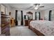 Main bedroom with hardwood floors, large windows, and a walk-in closet at 335 Gum Creek Rd, Roopville, GA 30170