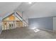 Spacious bonus room with a large window and neutral colored walls at 335 Gum Creek Rd, Roopville, GA 30170